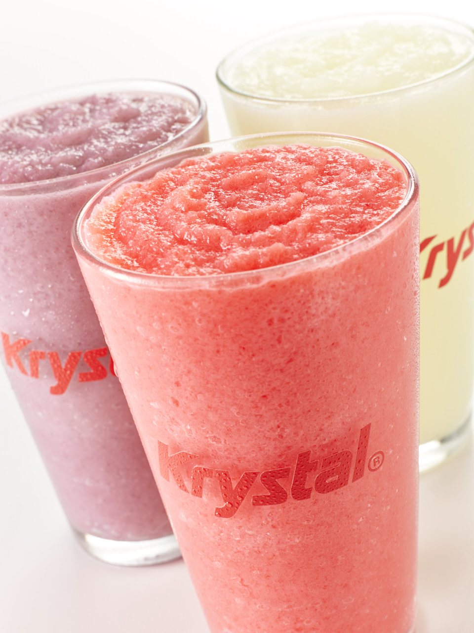 Raspberry, strawberry and citrus slushies in clear Krystal cups