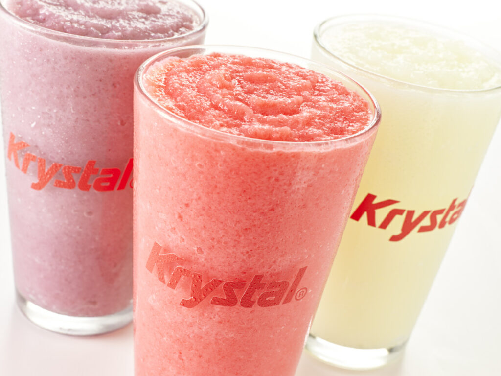 Raspberry, Strawberry, and Citrus slushies in clear glass Krystal cups.